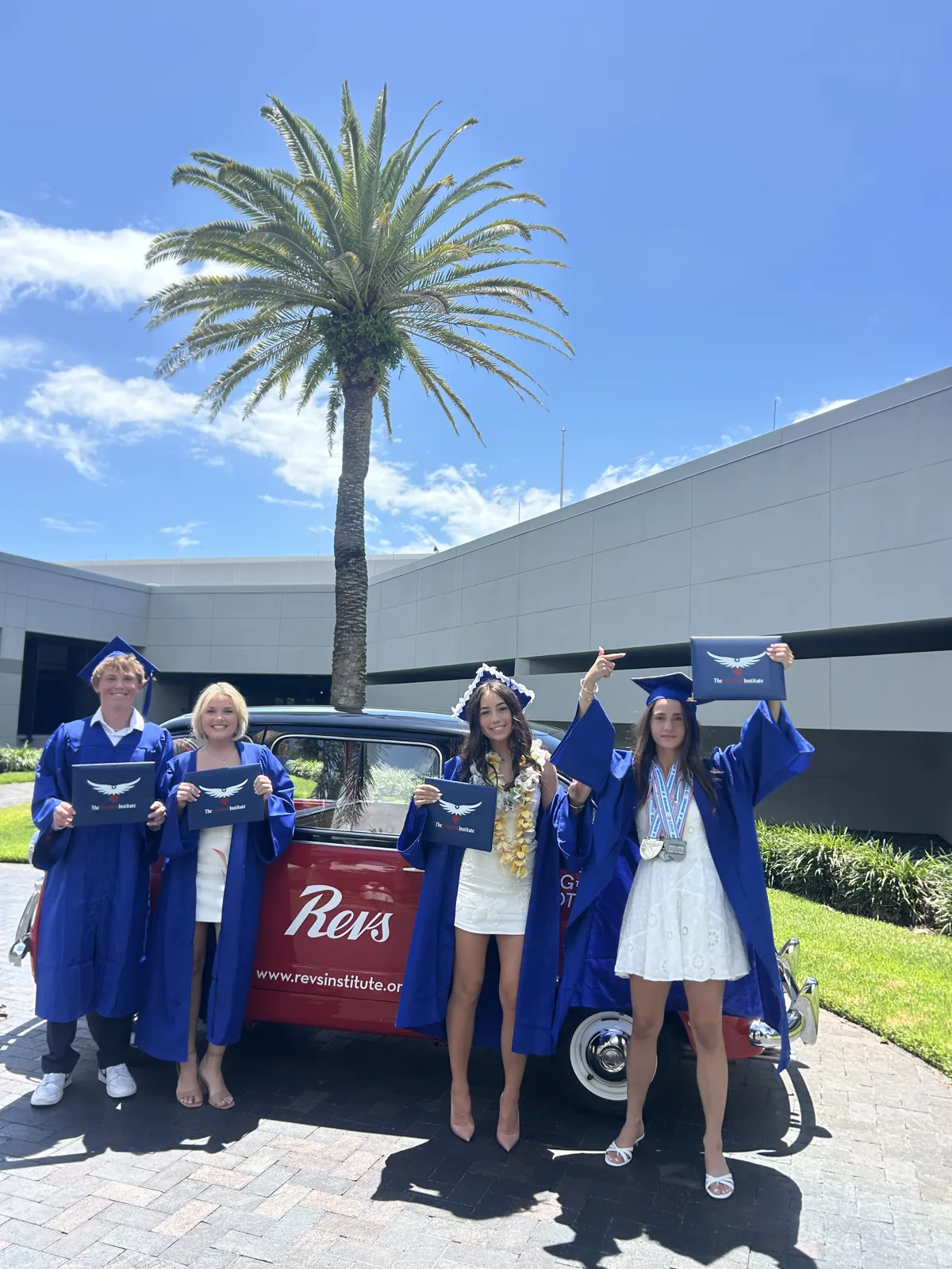Freedom Class of 2026 graduates in front of Revs Institute