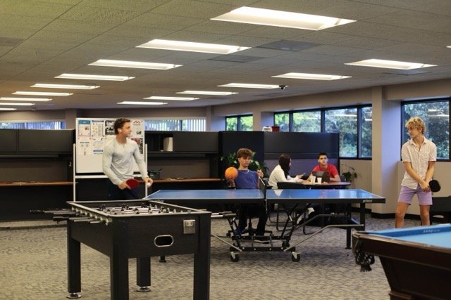 Freedom Institute students enjoying ping pong in the student union