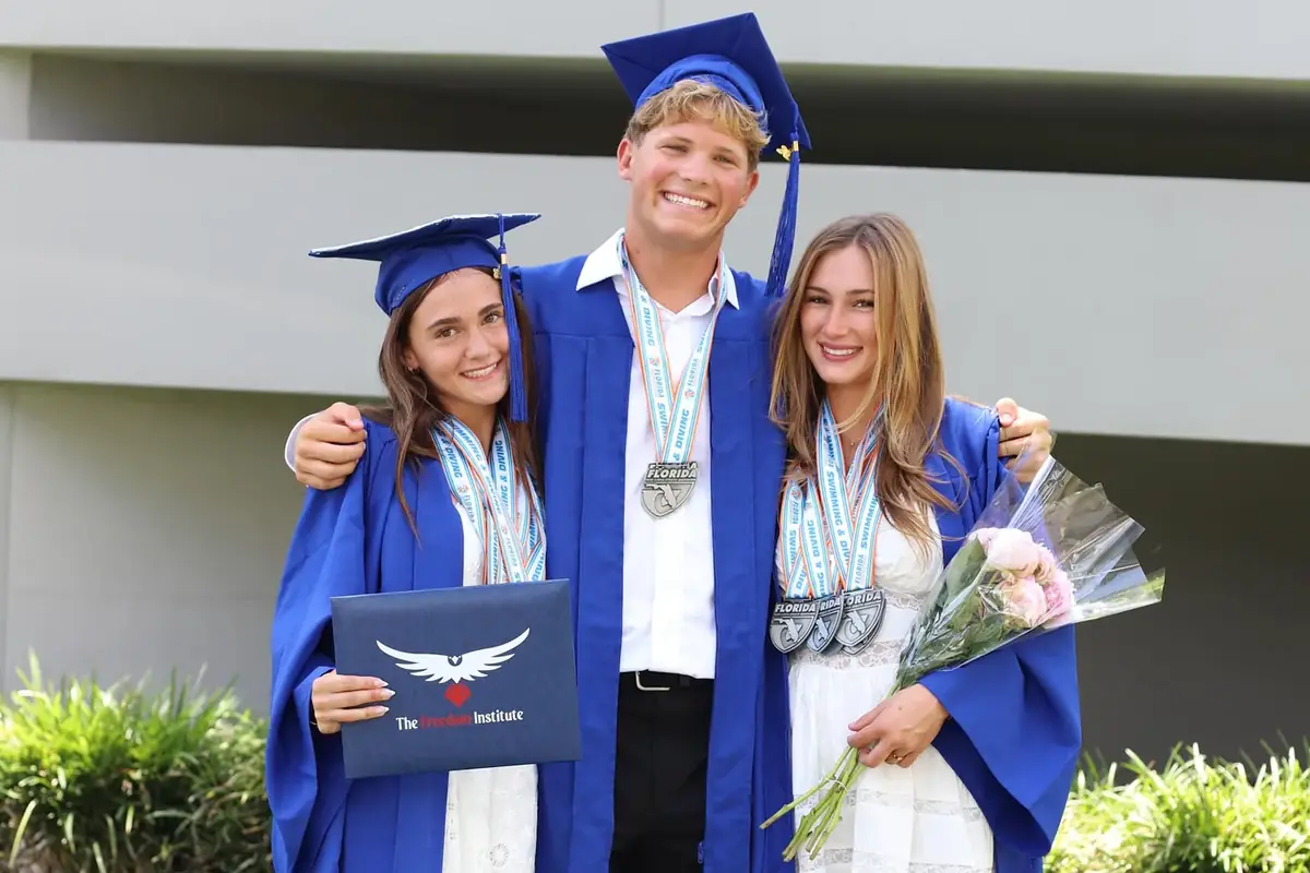 Freedom Institute graduates celebrating at commencement