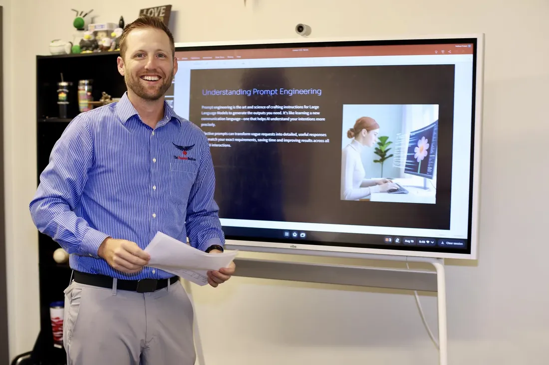 A Freedom Institute educator presenting a lesson on prompt engineering